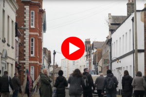 Group of people walking through Harwich town